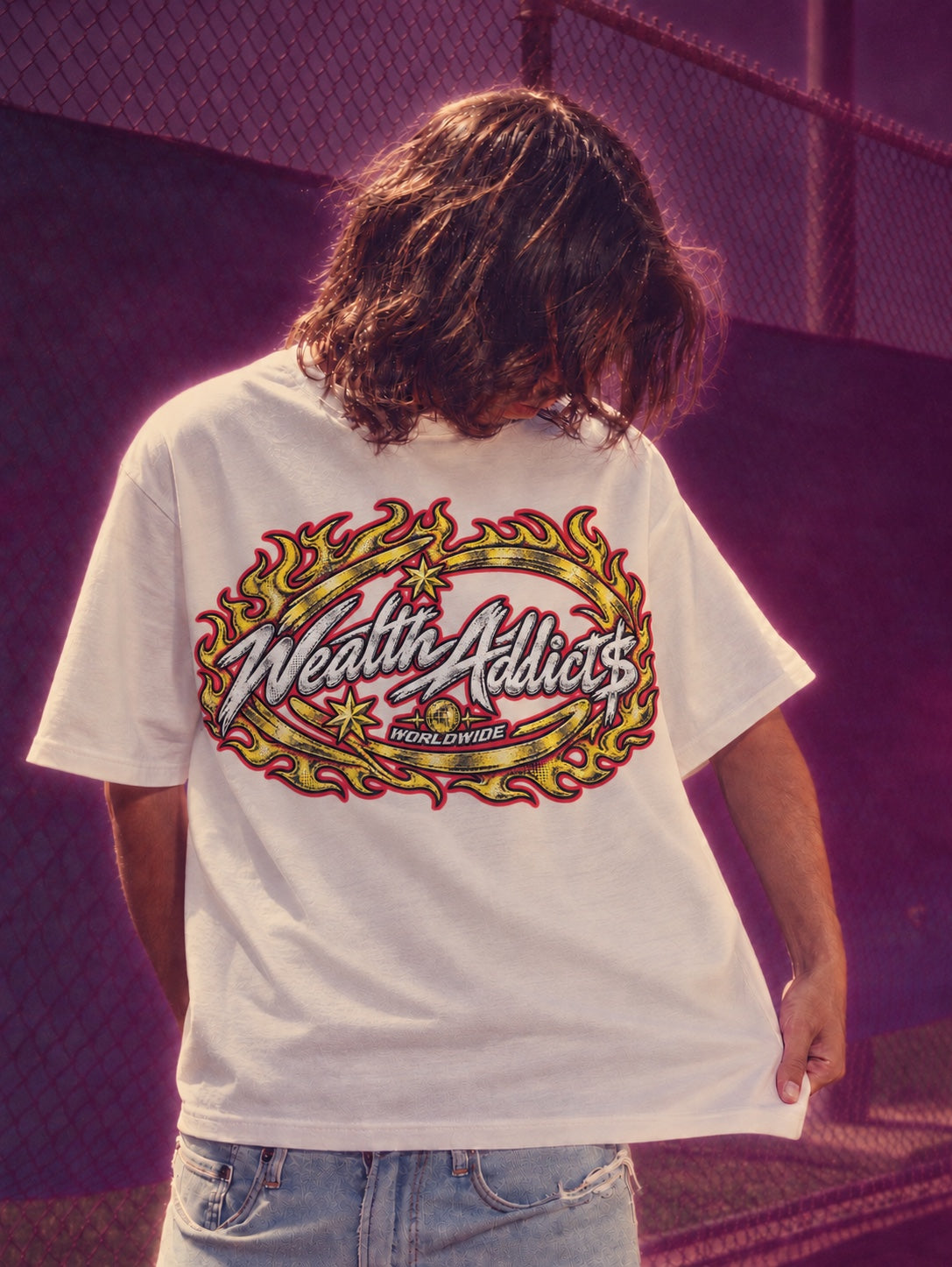 Wealth Addicts white graphic T-shirt with gold and red flames, purple haze campaign